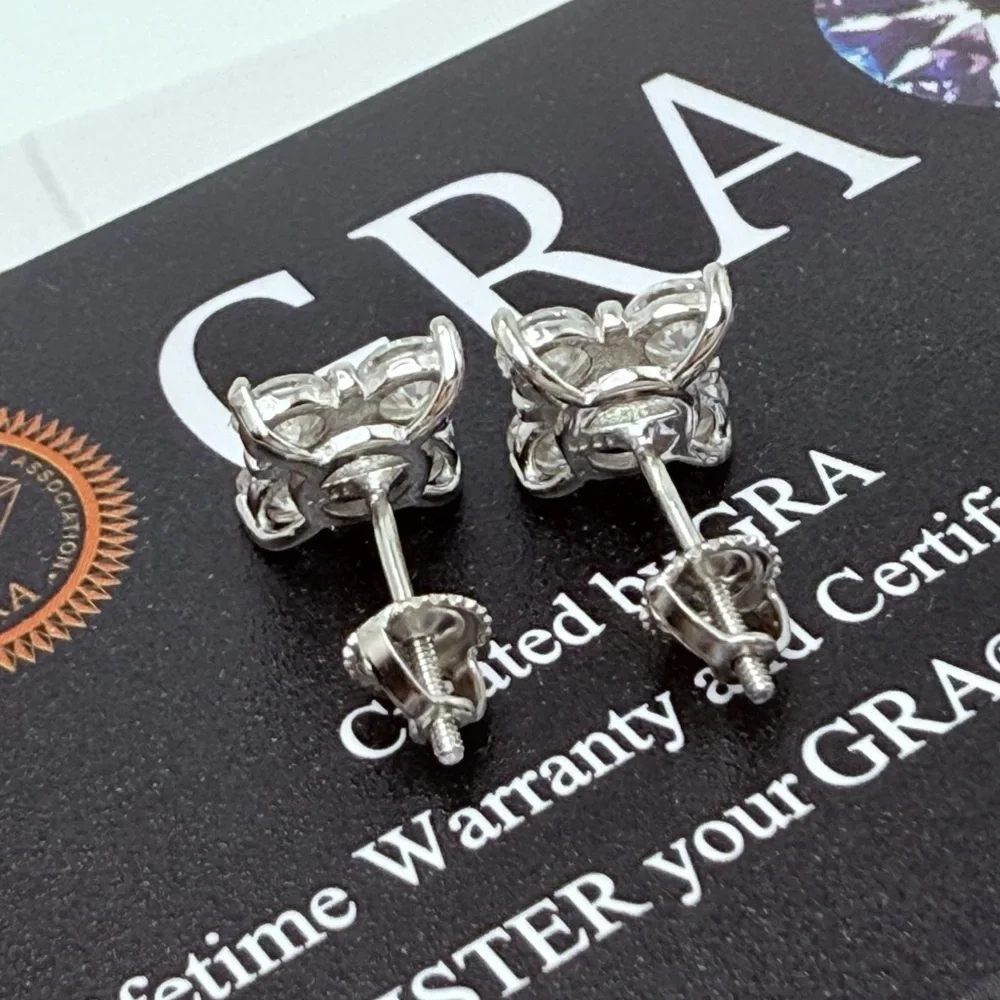 1.6ct Moissanite Cross Over Stud Earrings . Platinum plated .